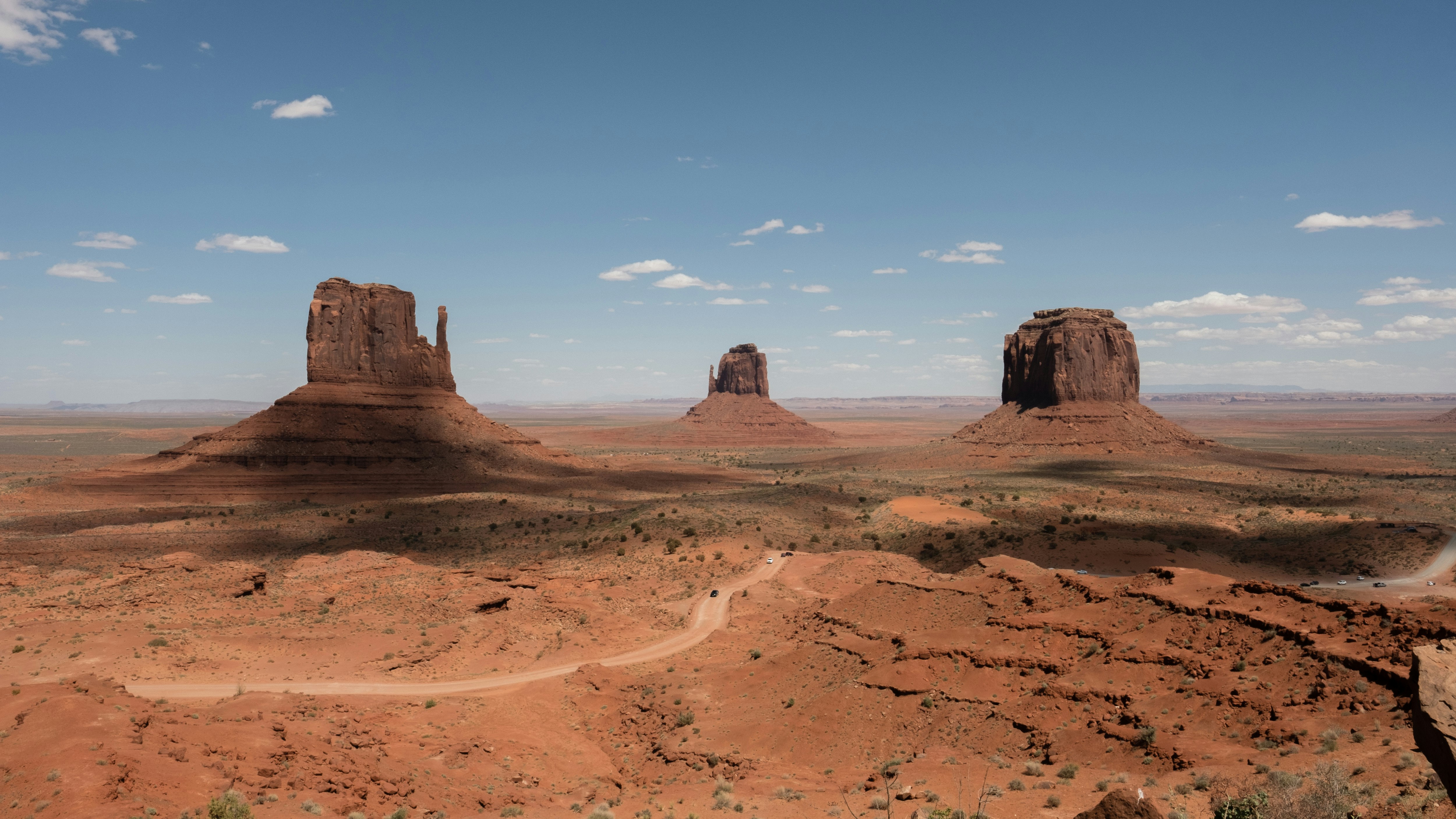 three mountains at desert during daytime